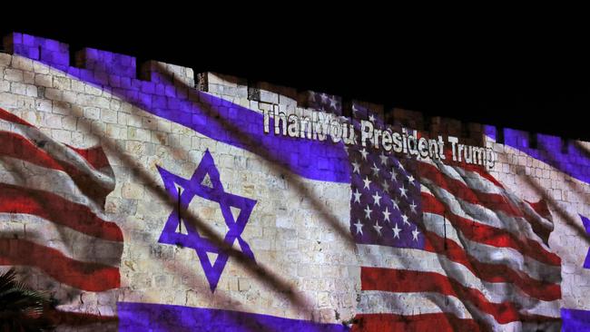 The Israeli and United States flags are projected on the walls of the ramparts of Jerusalem's Old City. Picture: AFP.