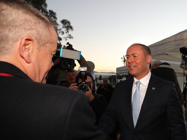 Opposition Leader Bill Shorten shaking hands with Treasurer Josh Frydenberg before appearing on morning TV out the front of Parliament House in Canberra. Picture: Kym Smith