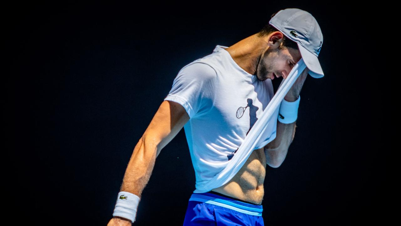 Djokovic training in Melbourne this week, feeling a different kind of heat 12 months on.