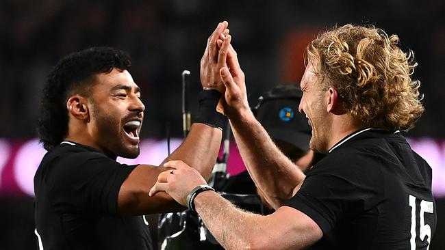 AUCKLAND, NEW ZEALAND - AUGUST 07: Damian McKenzie of the All Blacks celebrates with team mate Richie Mo'unga after scoring a try during the Rugby Championship and Bledisloe Cup match between the New Zealand All Blacks and the Australia Wallabies at Eden Park on August 07, 2021 in Auckland, New Zealand. (Photo by Hannah Peters/Getty Images)