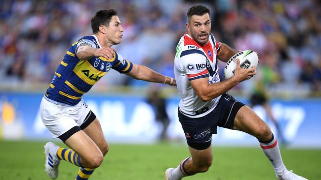 James Tedesco of the Roosters is tackled in goal by Mitchell Moses of the Eels during the Round 3 NRL match between the Parramatta Eels and Sydney Roosters at ANZ Stadium, Sydney, Friday, March 29, 2019. (AAP Image/Dan Himbrechts) NO ARCHIVING, EDITORIAL USE ONLY