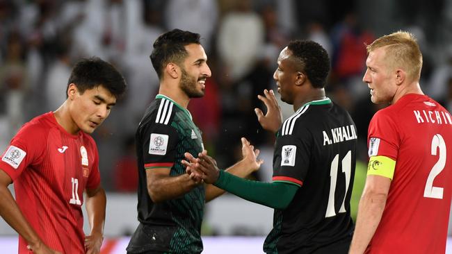 United Arab Emirates' forward Ahmed Khalil (C-R) is congratulated United Arab Emirates' forward Ali Mabkhout (C-L) during the 2019 AFC Asian Cup Round of 16 football match between UAE and Kyrgyzstan at the Zayed Sports City Stadium in Abu Dhabi on January 21, 2019. (Photo by Khaled DESOUKI / AFP)