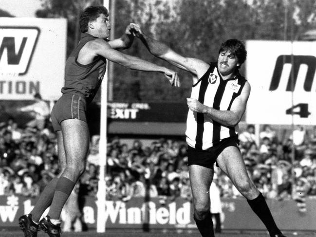 Brian Taylor (right) battles Fitzroy’s Gary Pert (left)