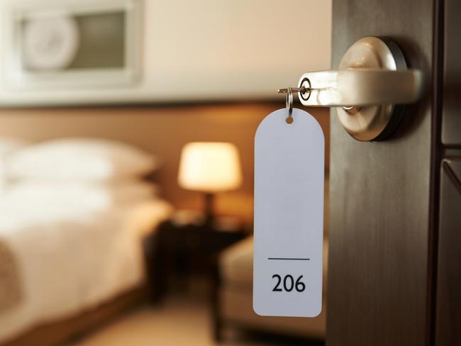 Opened door of hotel room with key in the lock. Picture: iStockFAQ What to do when ... Sarah Nicholson, Escape