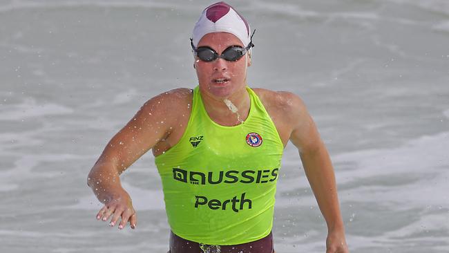 Commonwealth Games swimming silver medallist Laura Taylor, of Northcliffe SLSC, wins the women's under-19 surf race at Australian surf lifesaving championships at Scarborough Beach. Photo: HARVPIX.COM