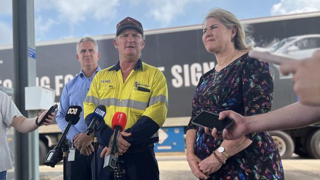 Infrastructure Minister Joel Bowden, trucker Andrew Ailmore and Chief Minister Eva Lawler announce fresh food is back on Top End shelves after floods disrupted supply. Picture: Fia Walsh