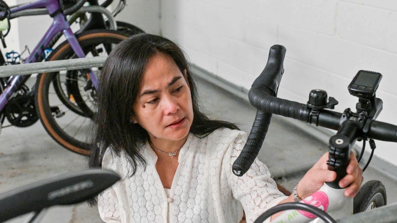 Mrs Badilla with a bike belonging to her daughter, who was an avid cyclist and motorsport lover. Picture: Brenton Edwards