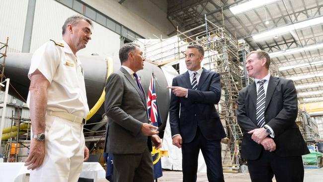 Vice Admiral Jonathan Dallas Mead, Acting Prime Minister Richard Marles, Premier of South Australia Peter Malinauskas and Nick Champion MP at Osborne shipyard.