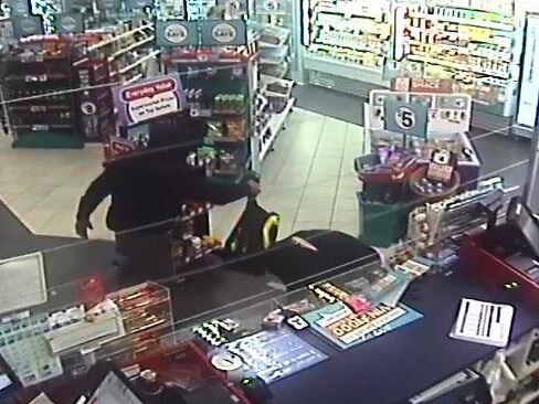 CCTV image of men who broke into the Caltex Service Station at Forresters Beach.