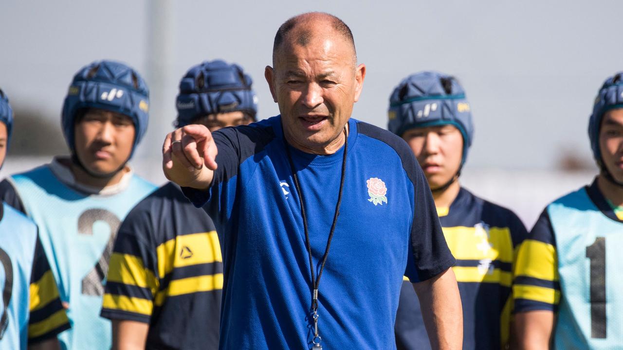 (FILES) This file photo taken on November 1, 2019 shows then-England head coach Eddie Jones (C) leading a rugby practice session with Japanese schoolchildren after the England captain's run at the Fuchu Asahi Football Park in Tokyo during the Japan 2019 Rugby World Cup. Eddie Jones would "definitely be interested" in coaching Japan but has yet to receive an offer, Japanese media reported on November 8, 2023, the former England and Australia coach as saying. (Photo by Odd ANDERSEN / AFP)