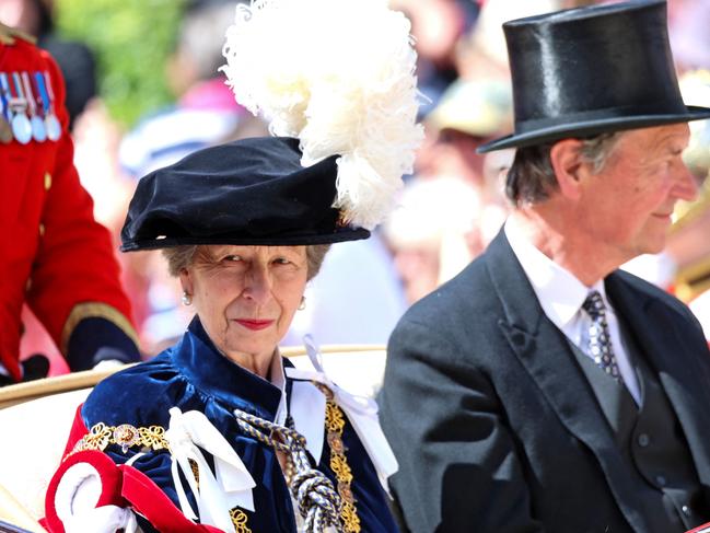 (FILES) Britain's Princess Anne, Princess Royal (L) and Vice Admiral Timothy Laurence leave by carriage after attending the Order of the Garter service, at St George's Chapel, at Windsor Castle, in Windsor, southern England, on June 17, 2024. Buckingham Palace said in a statement on June 24, that Princess Anne sustained minor injuries and concussion following an incident on June 23 at the Gatcombe Park estate yesterday evening. Her Royal Highness remains in hospital, as a precautionary measure for observation and is expected to make a full and swift recovery. (Photo by Chris Jackson / POOL / AFP)