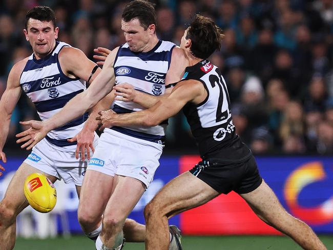 ADELAIDE, AUSTRALIA - JUNE 15: Patrick Dangerfield of the Cats is tackled by Connor Rozee of the Power during the 2023 AFL Round 14 match between the Port Adelaide Power and the Geelong Cats at Adelaide Oval on June 15, 2023 in Adelaide, Australia. (Photo by James Elsby/AFL Photos via Getty Images)