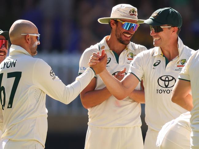 Three out of the four members of the most successful bowling quartet in Test cricket – Nathan Lyon, Mitch Starc and Pat Cummins. Picture: James Worsfold – CA/Cricket Australia via Getty Images