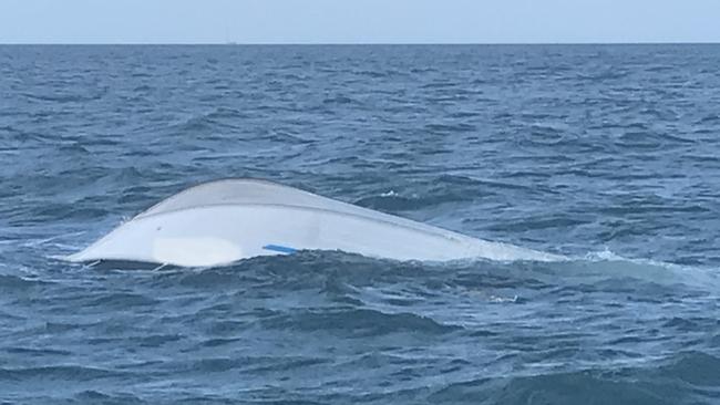 A capsized boat discovered by a rescue boat in the Whitsundays. Picture: VMR Whitsundays