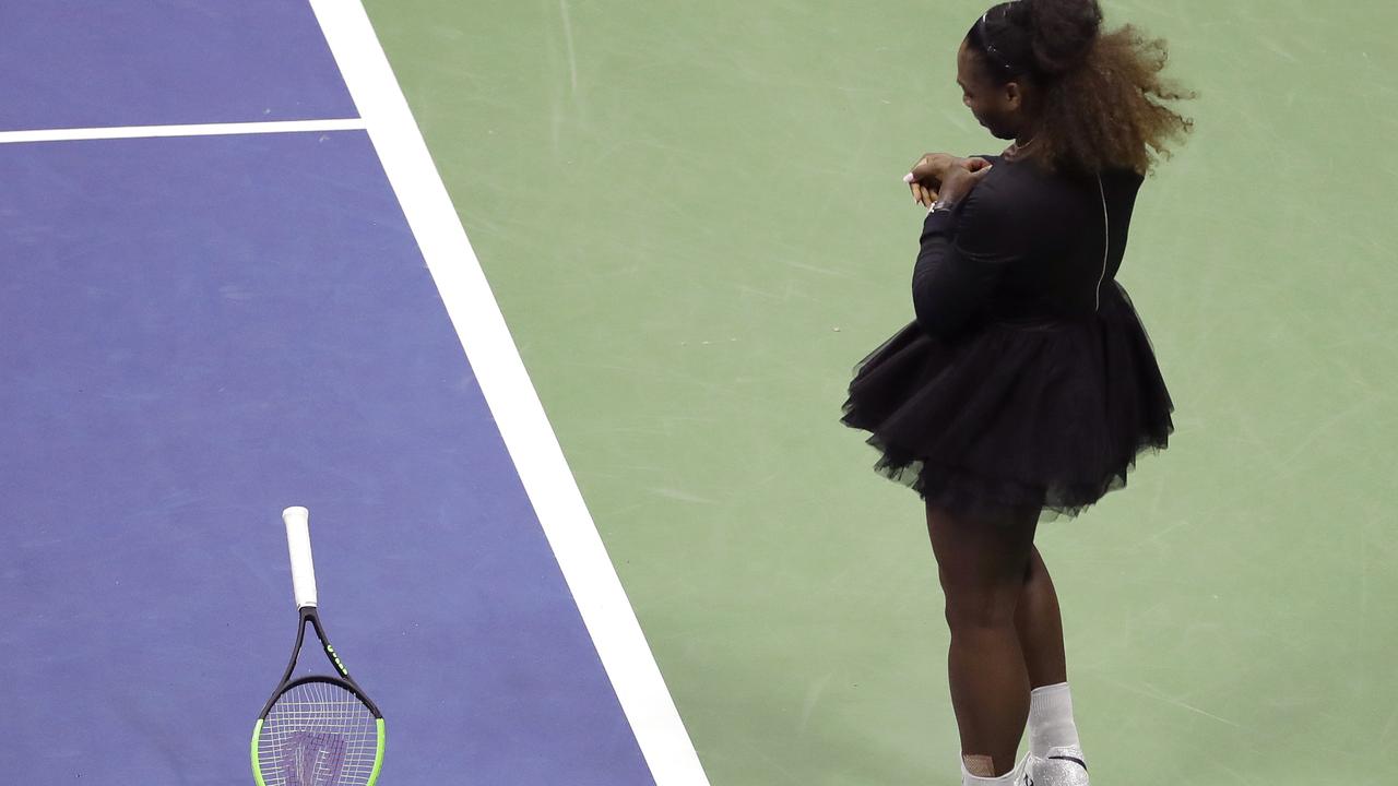 Serena Williams slams her racket on court during the women's final. (AP Photo/Seth Wenig)