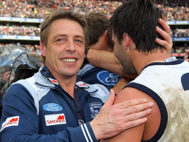 Mark Thompson celebrates the 2009 AFL premiership with Jimmy Bartel.