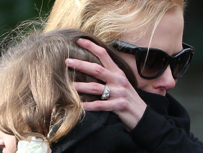 Nicole Kidman hugs her daughter after the service for the Antony Kidman Funeral at St Francis Xavier Catholic Church, Lavender Bay. Picture: Adam Taylor