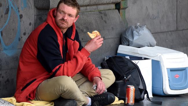 The man arrested by police two hours earlier returns with another bourbon. Picture: Nicole Garmston