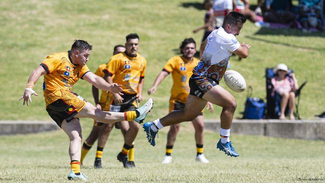 Jason Broome of Kambu kicks against Jaydon Dos Adams Memorial in the Warriors Reconciliation Carnival at Jack Martin Centre, Saturday, January 25, 2025. Picture: Kevin Farmer
