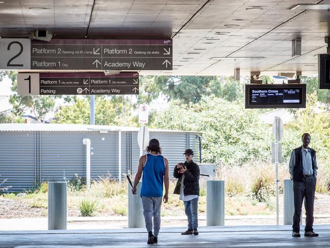 Youths involved in a stand-off at Wyndham Vale train station carry baseball bats. Picture: Jake Nowakowski