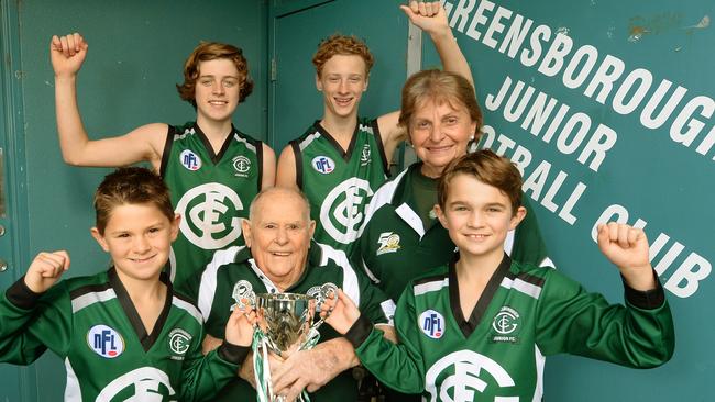 Bonnie Dickson, pictured with Greensborough junior players and fellow founding member Ray Skals, to celebrate the club’s 50th anniversary in 2014.