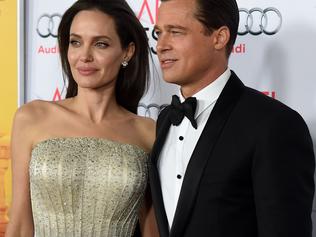 HOLLYWOOD, CA - NOVEMBER 05: Writer-director-producer-actress Angelina Jolie Pitt (L) and actor-producer Brad Pitt attend the opening night gala premiere of Universal Pictures' "By the Sea" during AFI FEST 2015 presented by Audi at TCL Chinese 6 Theatres on November 5, 2015 in Hollywood, California. Kevin Winter/Getty Images/AFP == FOR NEWSPAPERS, INTERNET, TELCOS & TELEVISION USE ONLY ==