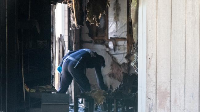 An investigator combs through the wreckage of the Maroubra pre-school torched in an alleged anti-semitic attack. Picture: Thomas Lisson