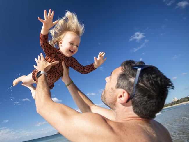 2 year old Elodie Spencer flies with her dad Jansen at Mooloolaba ahead of Queensland Day on June 6th. Picture Lachie Millard