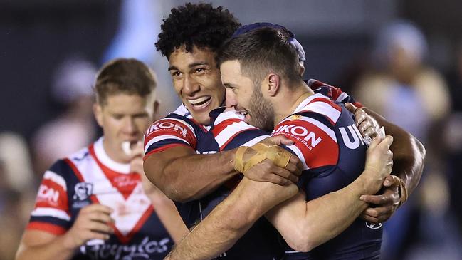 SYDNEY, AUSTRALIA - SEPTEMBER 09:  James Tedesco, Luke Keary and Siua Wong of the Roosters celebrate winning the NRL Elimination Final match between Cronulla Sharks and Sydney Roosters at PointsBet Stadium on September 09, 2023 in Sydney, Australia. (Photo by Mark Metcalfe/Getty Images)