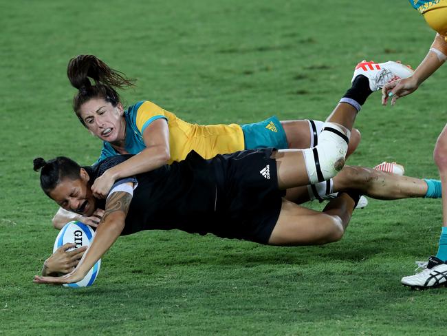 Alicia Quirk crunches Gayle Broughton. Picture: Adam Head