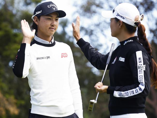 MELBOURNE, AUSTRALIA - NOVEMBER 30: Minjee Lee and Min Woo Lee high five during a media opportunity ahead of the 2022 ISPS HANDA Australian Open at Victoria Golf Club on November 30, 2022 in Melbourne, Australia. (Photo by Daniel Pockett/Getty Images)