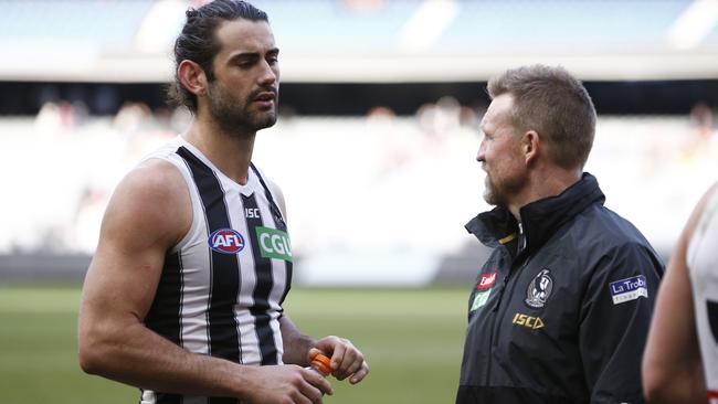 Brodie Grundy speaks to Collingwood coach Nathan Buckley. Photo: Daniel Pockett/AAP Image.