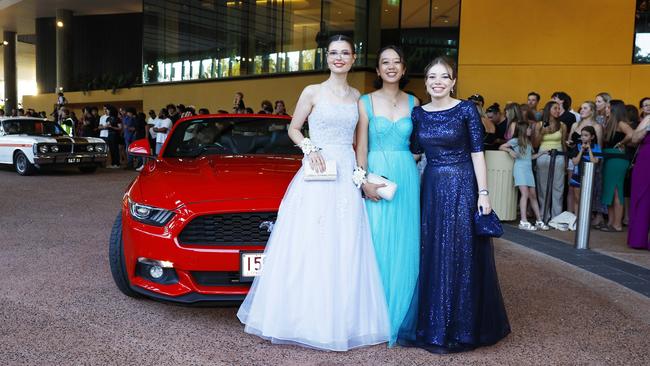 Shani Whittaker, Evelyn Markey and Hannah Hitch arrive at the Trinity Bay High School formal evening, held at the Cairns Convention Centre. Picture: Brendan Radke