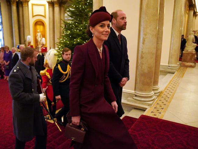 Princess Catherine climbs the stairs at Buckingham Palace after the welcome. Picture: Getty Images