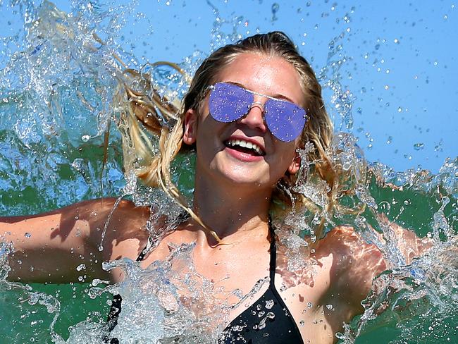 Sheldon Williams, 20, Coolum Beach, (0424428800), cooling off in Kings Beach during the hot weather, Caloundra. Photographer: Liam Kidston