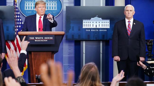 Donald Trump and Mike Pence in the daily White House briefing. Picture: AFP.