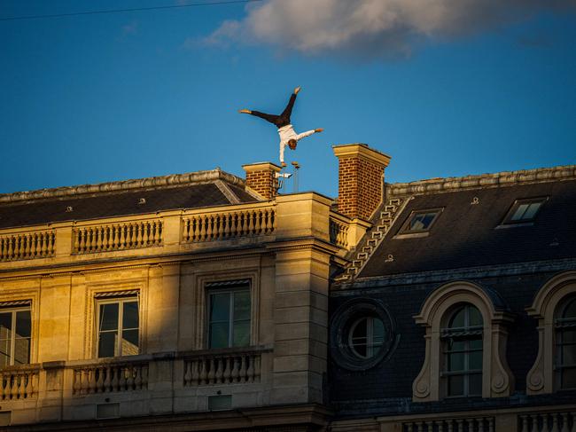 A dancer from the French group ‘Compagnie L’Oublié(e)’ performs a show on the roof of Palais-Royal, as part of the European Heritage Days and the Cultural Olympiad in Paris. Picture: Dimitar Dilkoff/AFP 