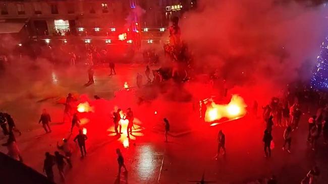 Flares were set off at the Champs-Elysees