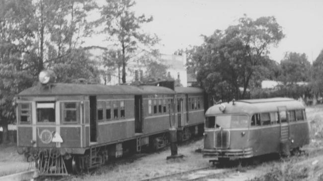 The rail motor, with trailer, and the pay-bus stored behind the turntable at the rear of Platform 1. Behind the paybus, to the right, may be seen the gentle slope of the original approach to the station from George Street.