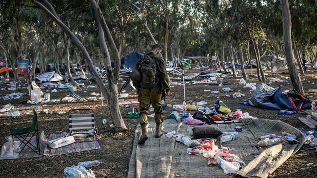 An Israeli soldier patrols near Kibbutz Beeri, in southern Israel, on October 12, close to the place where 270 revellers were killed by militants during the Supernova music festival on October 7. picture: Aris Messinis/AFP