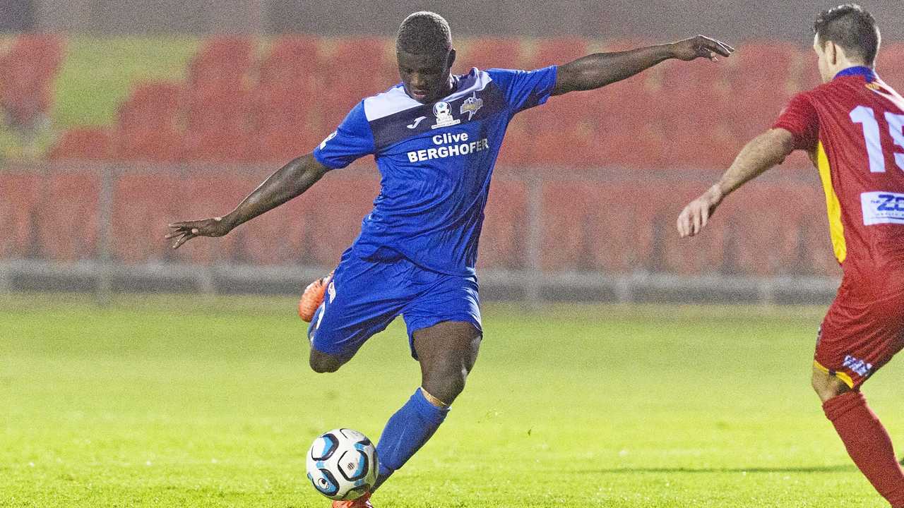 ON TARGET: South West Queensland Thunder midfielder Kimba Kibombo takes a shot on goal against North Queensland United. Picture: Kevin Farmer