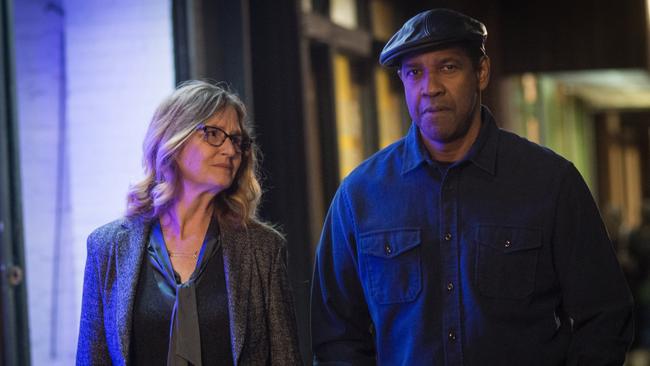 Robert McCall (Denzel Washington) walks with Susan Plummer (Melissa Leo) in a scene from the Equalizer 2.