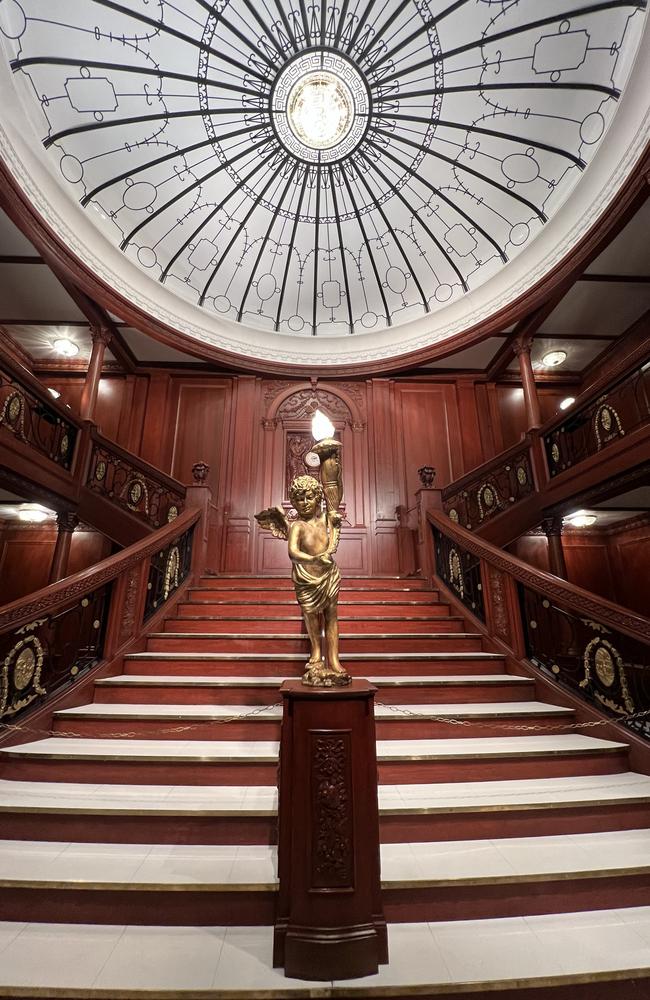 The Grand Staircase has been recreated for the exhibition. In real life it descended through six decks and the D Deck landing with the bronze cherub served as the first class reception hall.