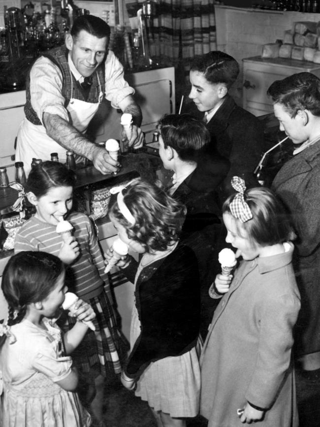 Jack Dyer serving children ice creams at his Richmond milk bar.