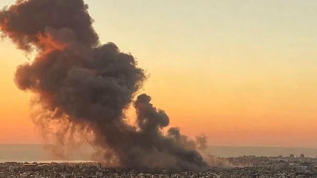 Smoke rises above Beirut's southern suburbs during an Israeli strike on September 27, 2024. (Photo by AFP)