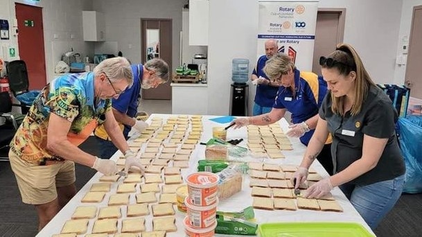 Rotary Club of Litchfield/Palmerston members prepare sandwiches for children at Humpty Doo Primary school. Picture: Supplied