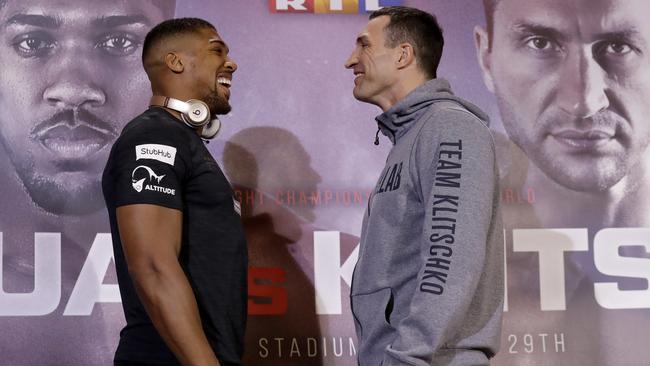 British boxer Anthony Joshua, left, and Ukrainian boxer Wladimir Klitschko pose for the media. They fight tonight at Wembley Stadium.