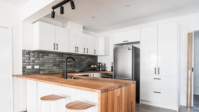 A stylish kitchen upgrade with timber benchtops, sleek cabinetry, and black fixtures added major appeal for buyers looking for a move-in-ready home.