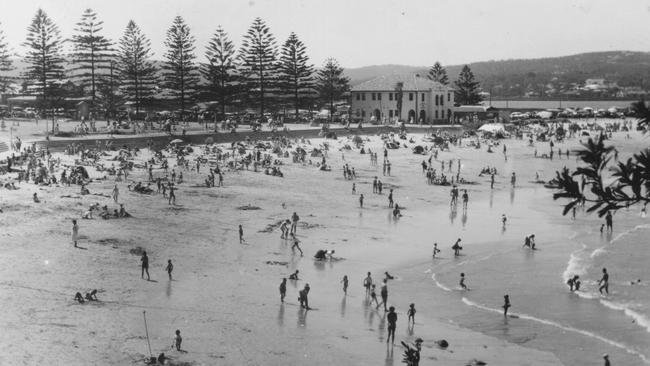 An historic shot of people enjoying Dee Why Beach.