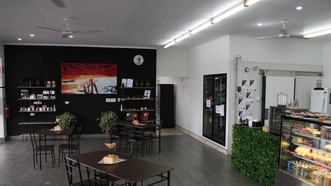 The inviting interior of the Chameleon Cafe featuring products from local artisans The Bearded Creator and The Reis Collection.